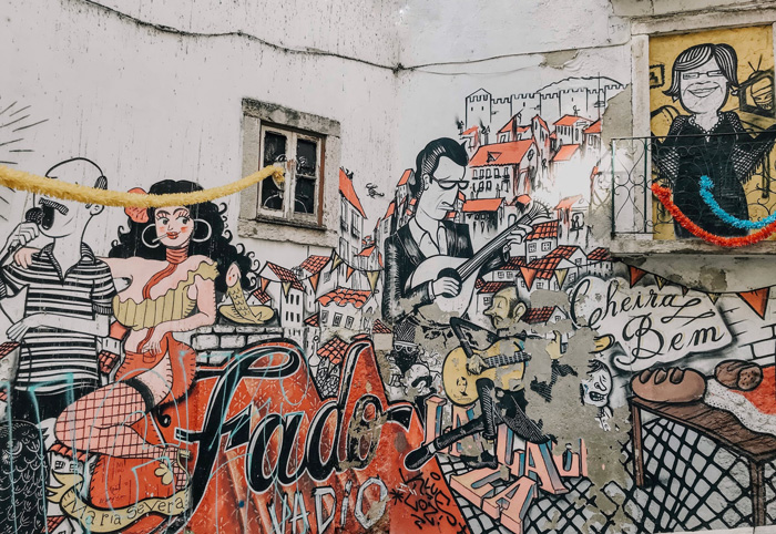Graffiti art in Lisbon featuring fado music scene, highlighting culture facts reflecting the diversity and beauty of the world.