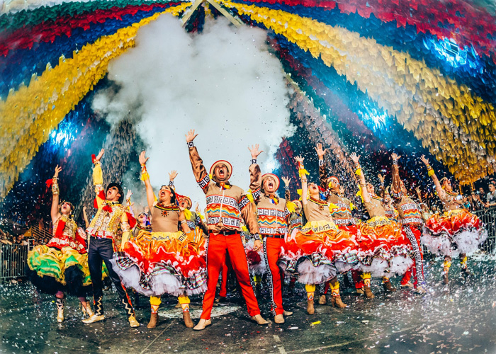 Dancers celebrating Festa Junina in colorful costumes on stage, showcasing culture facts reflecting diversity and beauty.