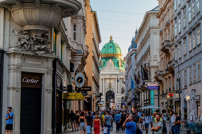 People walking on a busy street in Vienna, Austria, showcasing culture diversity and the beauty of the world.