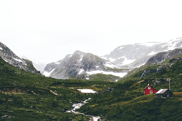 Snowy mountain landscape in Flåm, Norway showcasing natural diversity and beauty of world cultures and terrains.