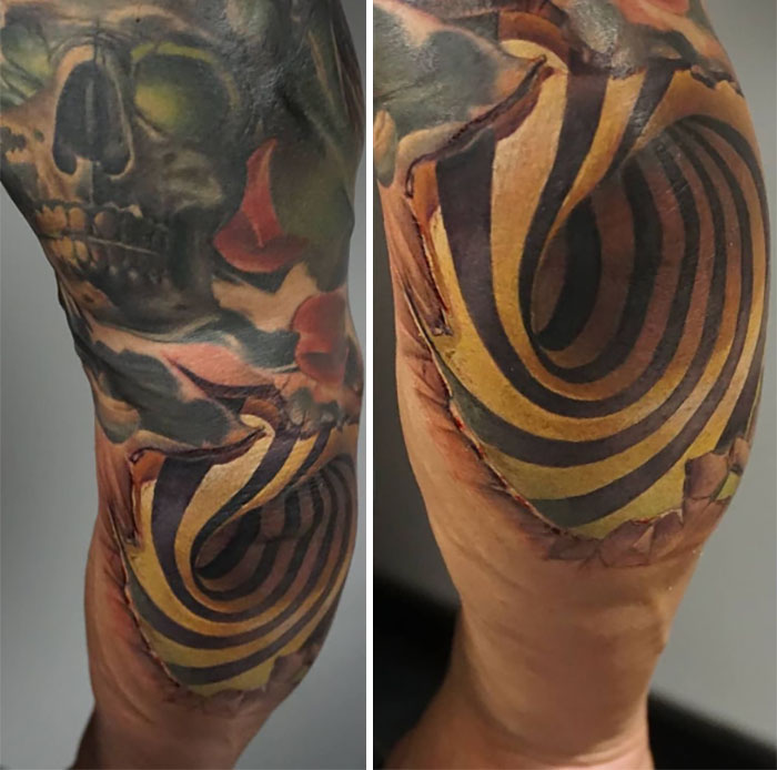 Vibrant skull and spiral design elbow tattoo with bold colors and intricate details.