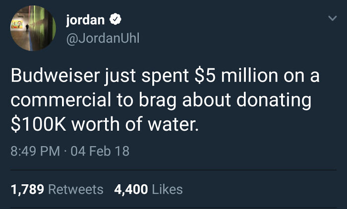 Tweet criticizing Budweiser's $5 million commercial boasting a $100K water donation, highlighting billionaire wealth gap issues.