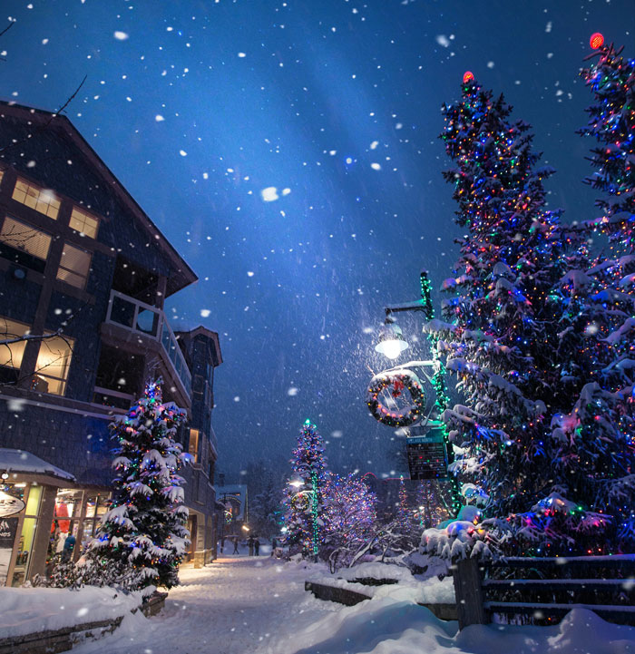 Street with Christmas tree and snow 