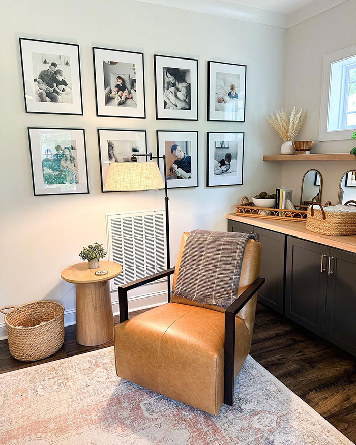 Living room corner with framed pictures, leather chair, and stylish home decor ideas blending comfort and modern design.