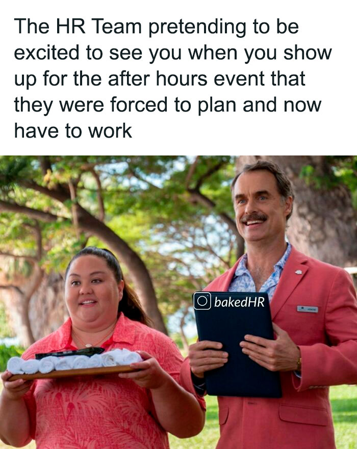 Two HR professionals smiling awkwardly at a work event, one holding a tray and the other a clipboard, outdoors.
