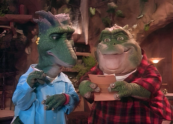 Two dinosaur characters from a TV show, highlighting things that inevitably make people look older.