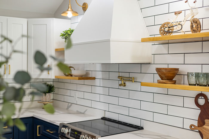 white brick backsplash with wooden shelves