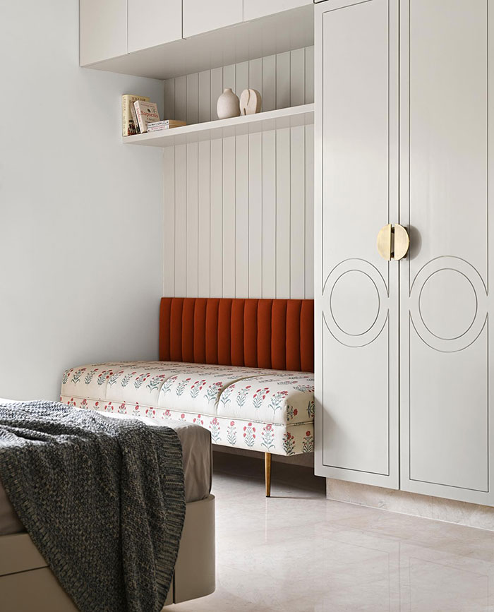 Bright master bedroom ideas featuring different zones with red accents and modern storage solutions.