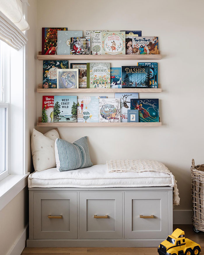 Cozy bright corner reading nook with cushions and bookshelves, a perfect master bedroom ideas design for relaxation.