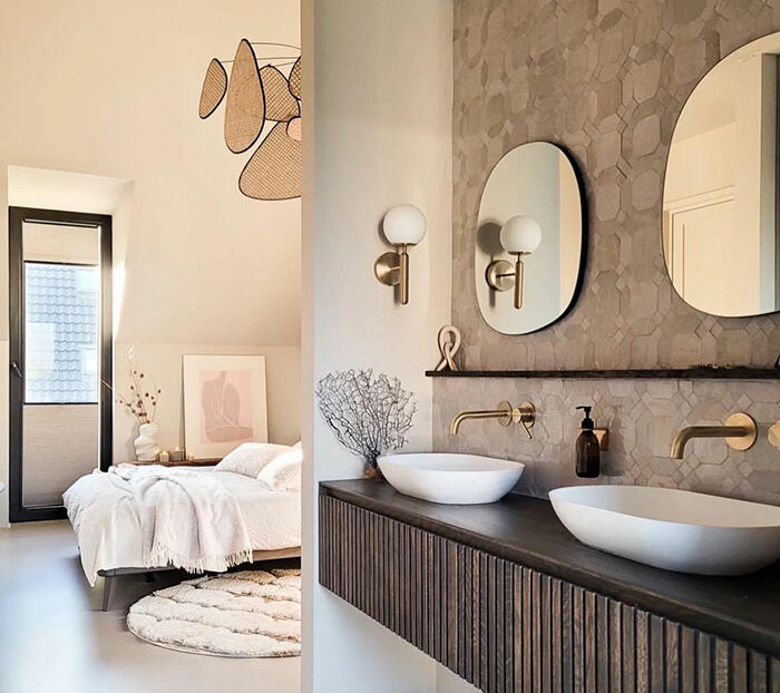 Bright master bedroom ideas featuring an en suite bathroom with modern sinks, round mirrors, and warm natural lighting.