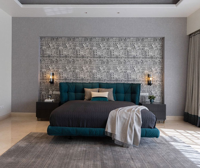 Grey master bedroom featuring a blue bed, modern wallpaper, and minimalist design showcasing master bedroom ideas.