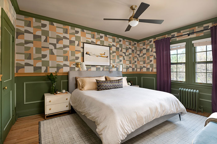 Patterned and symmetrical master bedroom featuring muted tones, geometric wallpaper, and a cozy design for master bedroom ideas.