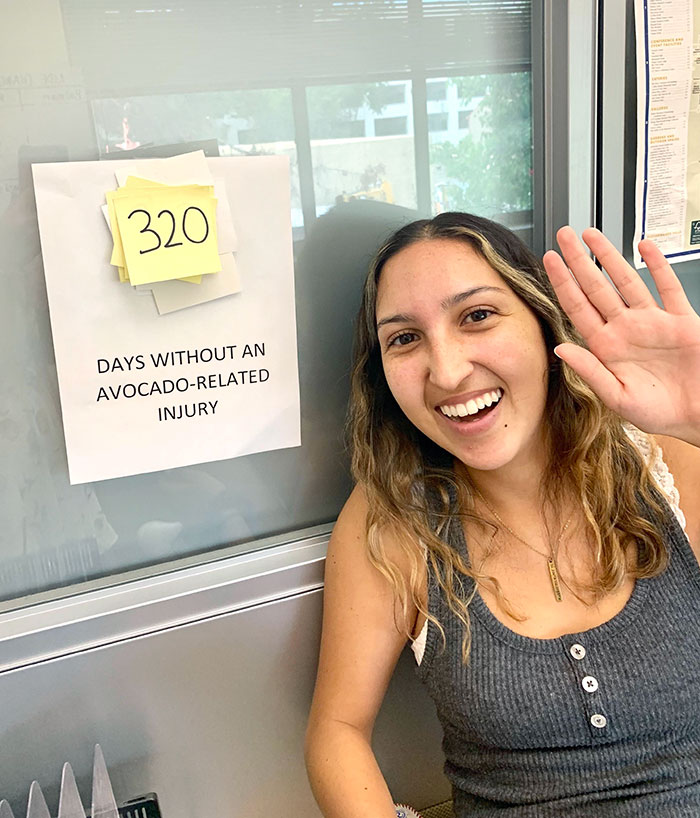 Nearly A Year Ago, My Coworker Needed Stitches After An Avocado Toast Accident. I Made This Sign For Her, And They're Still Updating It