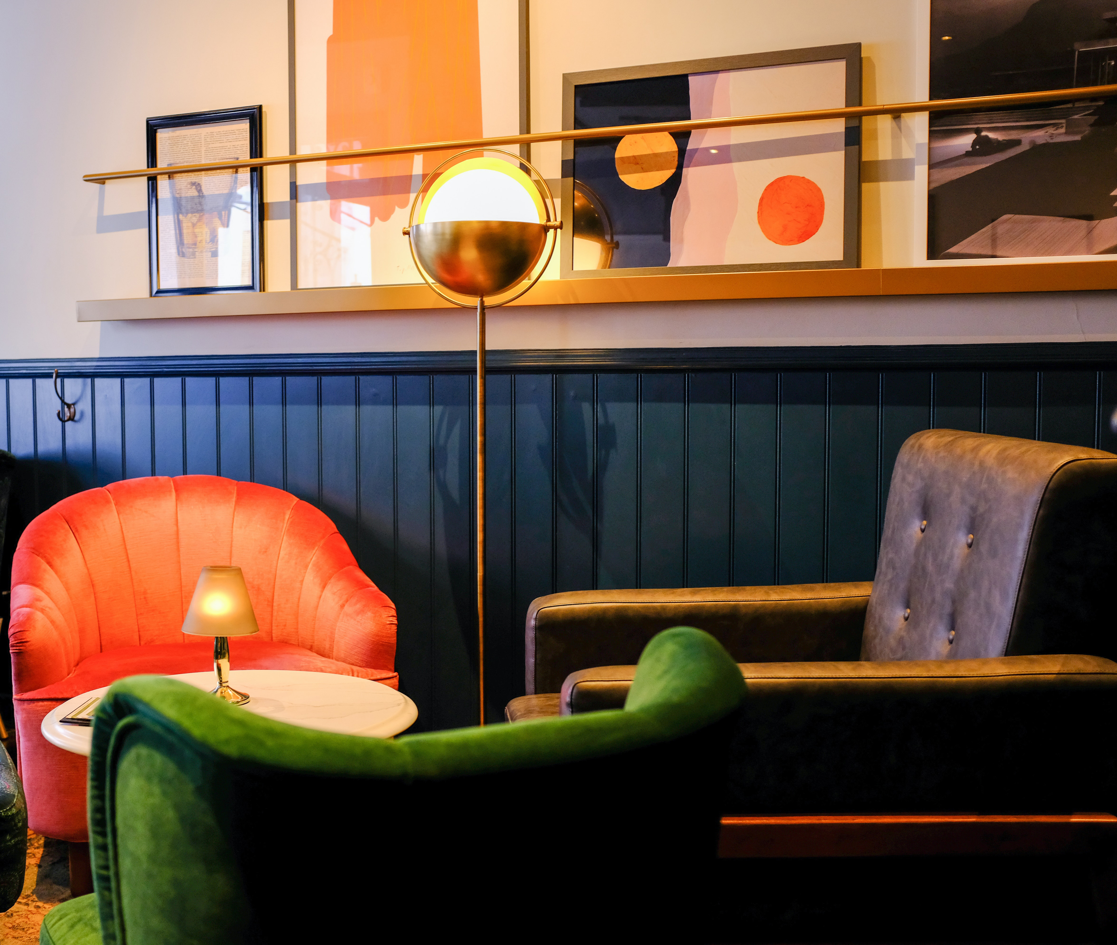 green and red chairs near the table