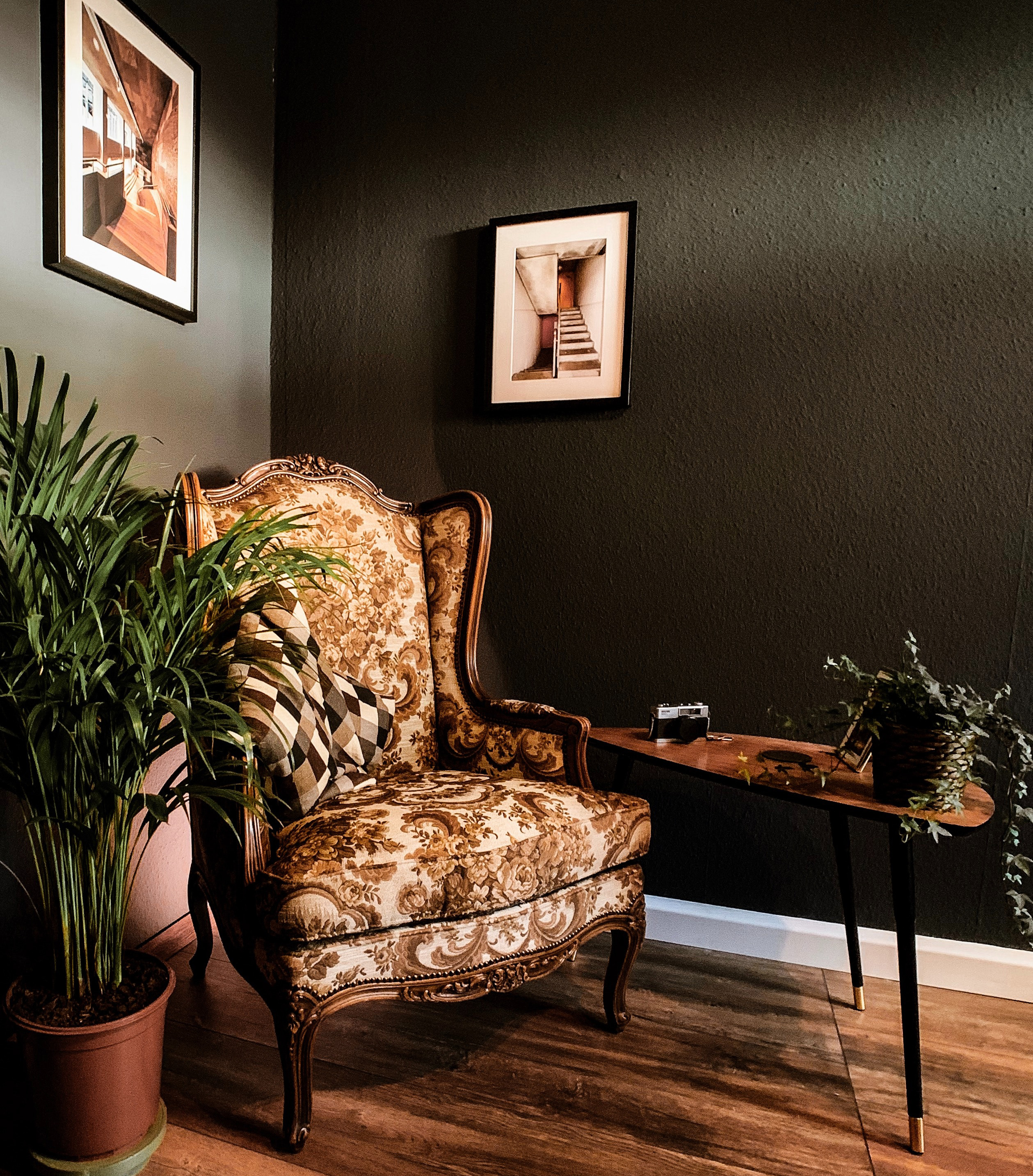 winged chair near console table