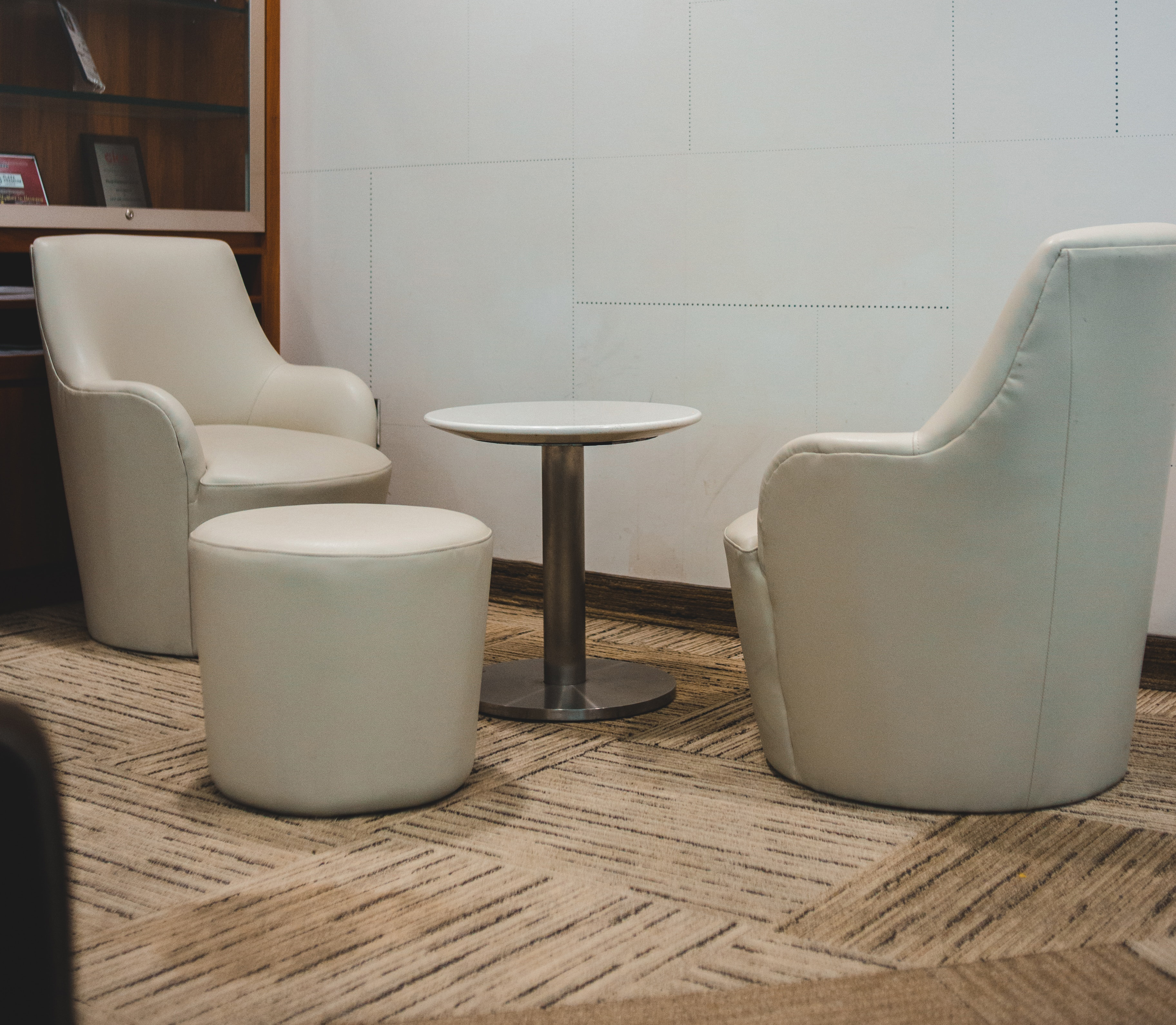 white chairs near brown wooden shelf