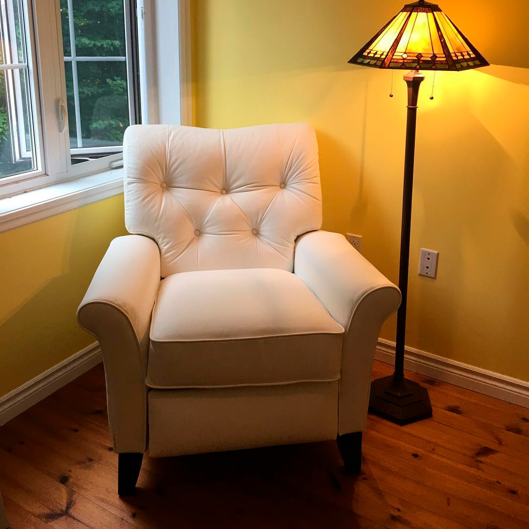 lazy boy chair near the window