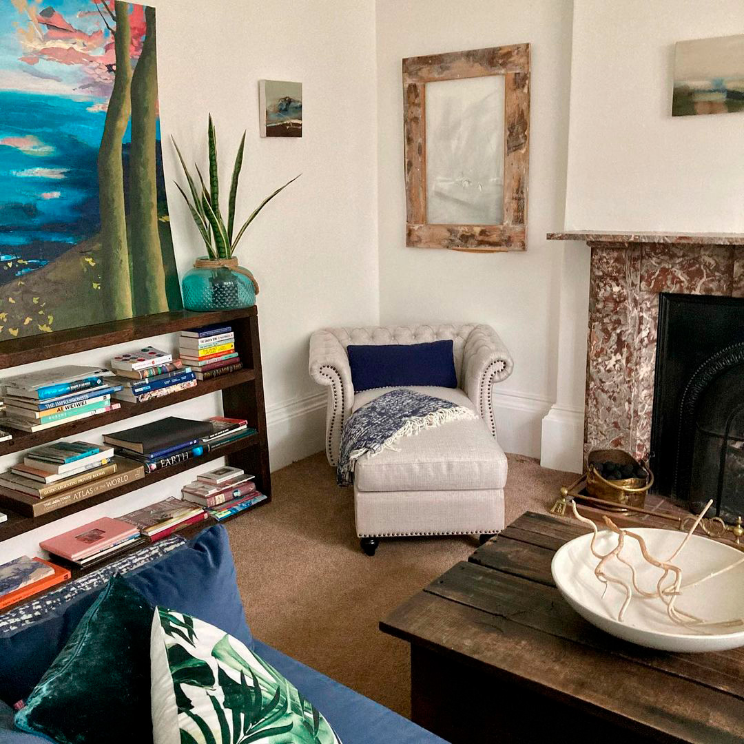 chair with ottoman near the fireplace