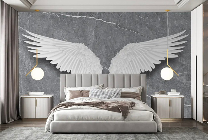 3D removable wallpaper with white angel wings above bed, creating a stylish and transformative bedroom decor.