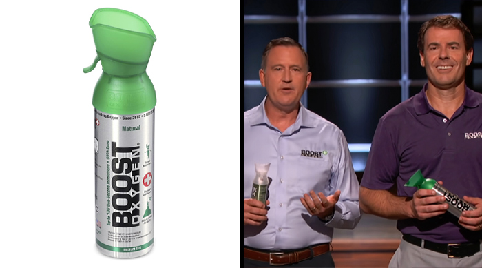 Two men presenting Boost Oxygen product on a TV show stage featuring Shark Tank success stories products.