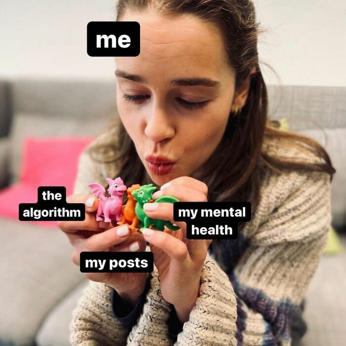 Small biz owner humor: woman holding toy dragons labeled 'algorithm', 'my posts', 'my mental health'.