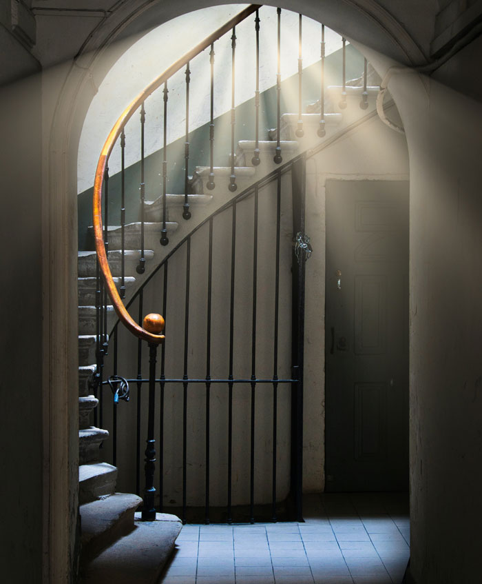 turned/circular stairs with wooden railings