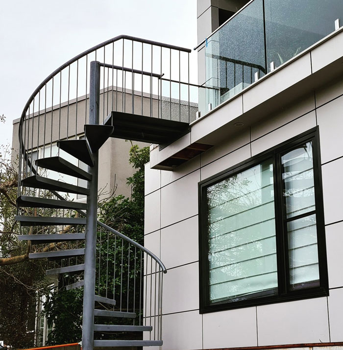 base prime spiral black stairs near the house
