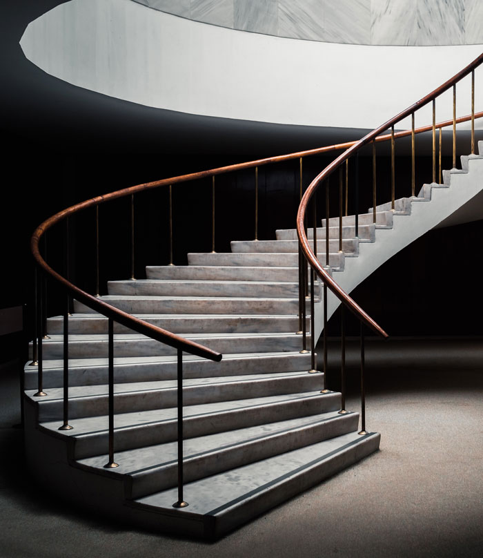 close up photo of gray spiral staircase