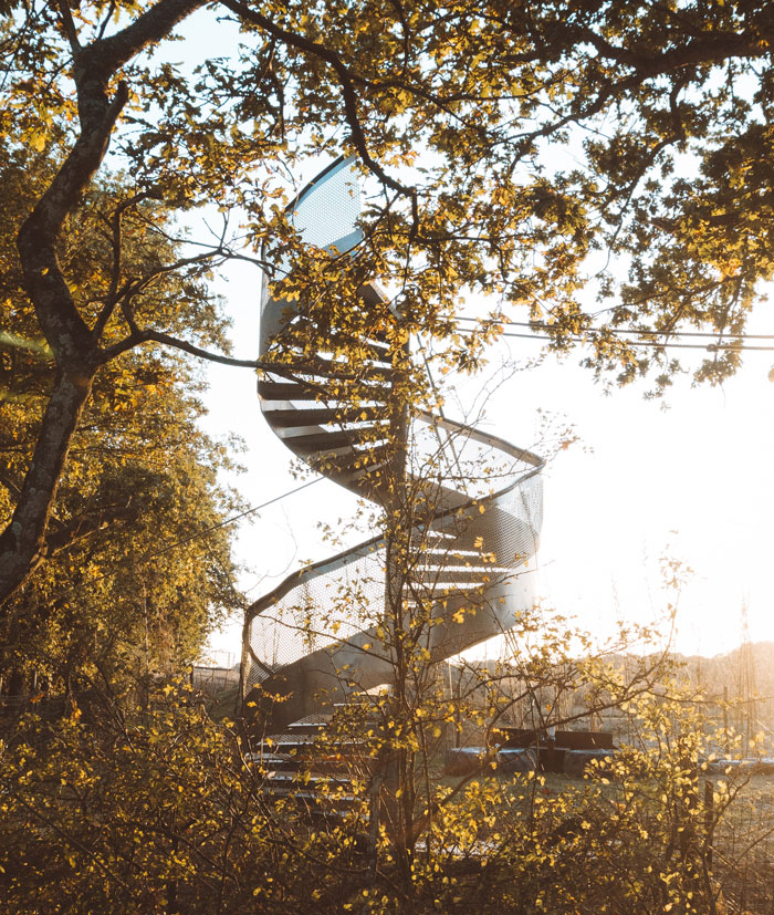 gray twirl stair near tree
