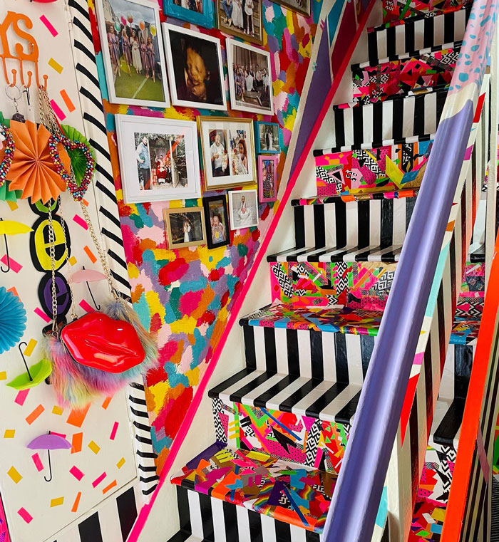 colorful maximalist style DIY staircase with wall gallery 