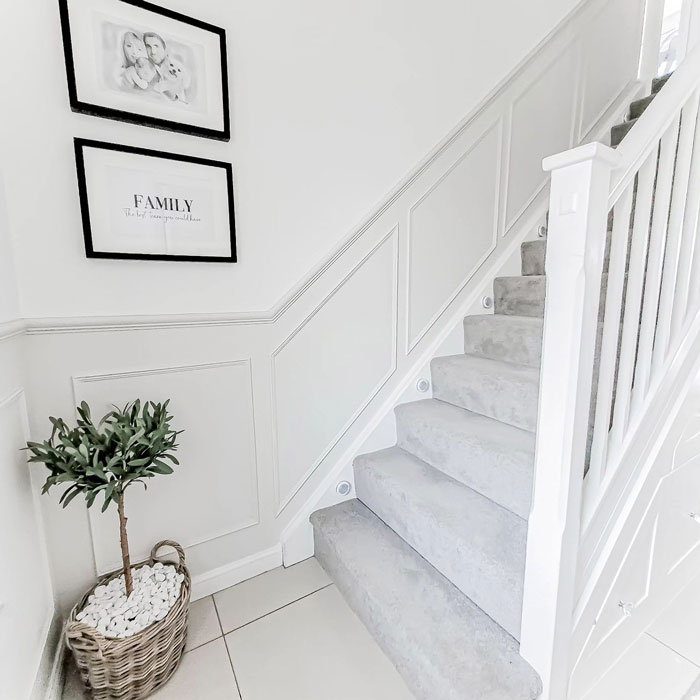 minimalist white stairs beside white wall