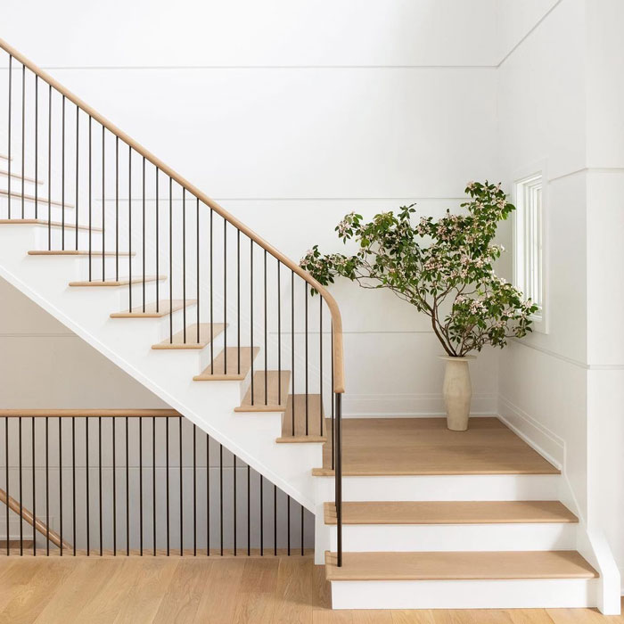 wooden and white stairs with landing