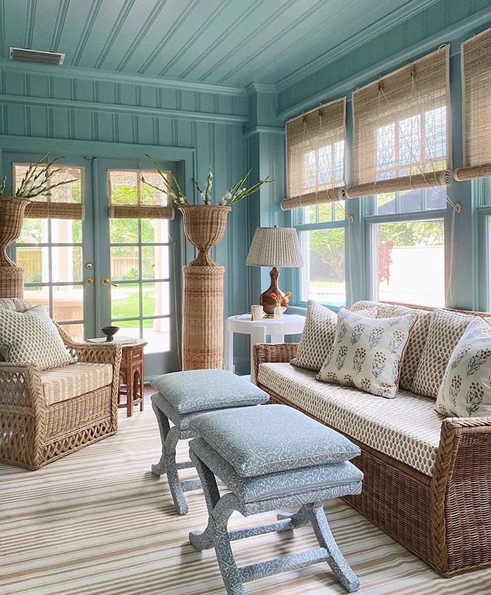 WIcker Material Furniture In A Cozy Blue Sunroom WIcker Material Furniture In A Cozy Blue Sunroom
