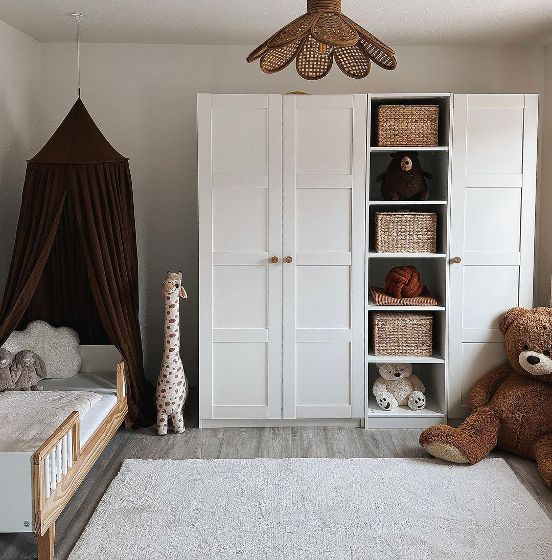 Taupe-colored kids' room decor with white furniture, plush toys, and cozy storage baskets.