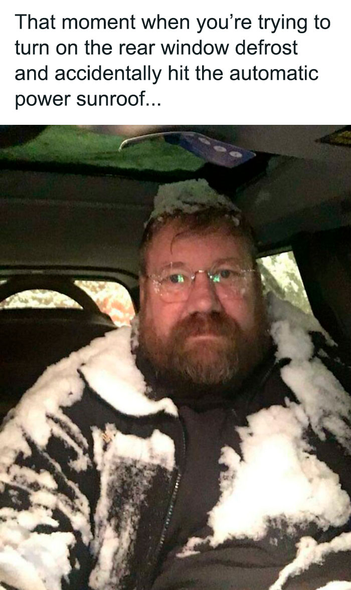 Man covered in snow inside a car, embodying a weather meme moment.