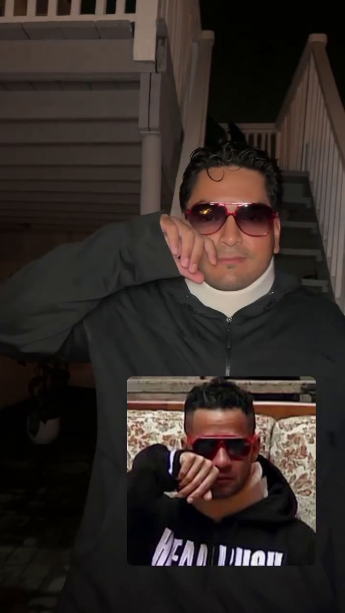 Person recreating a popular meme at a party with matching style and sunglasses.