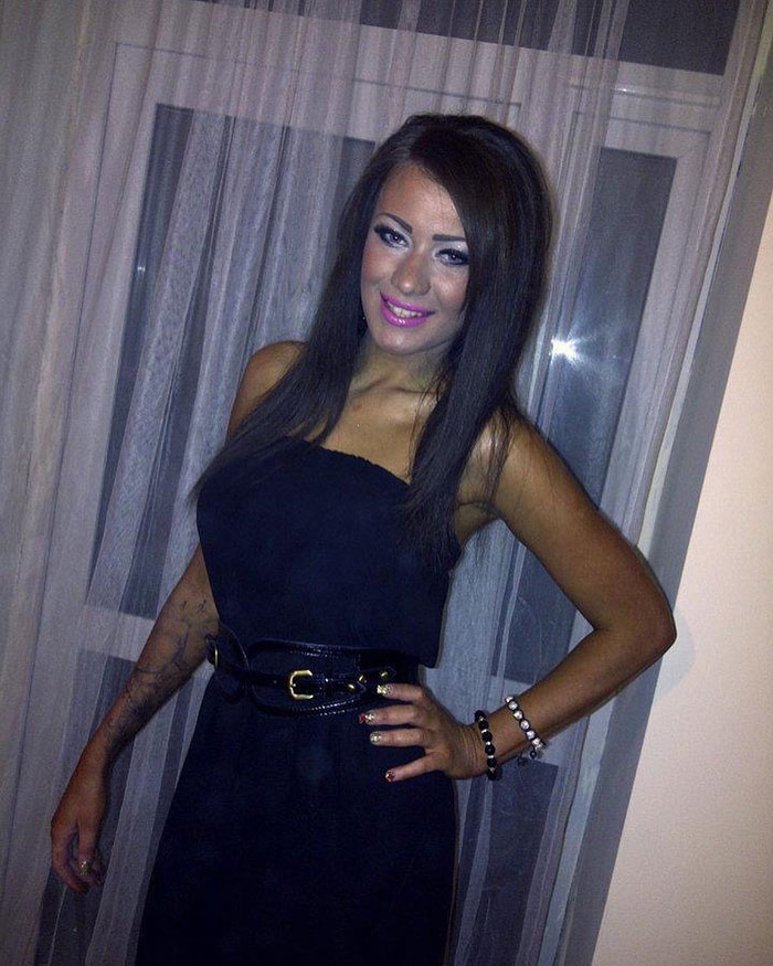 Woman posing in a black dress, showcasing style before becoming Britain’s most tattooed woman. Woman posing in a black dress, showcasing style before becoming Britain’s most tattooed woman.