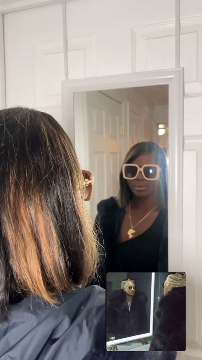 Meme-themed party guest in sunglasses mimics a mirror meme perfectly.