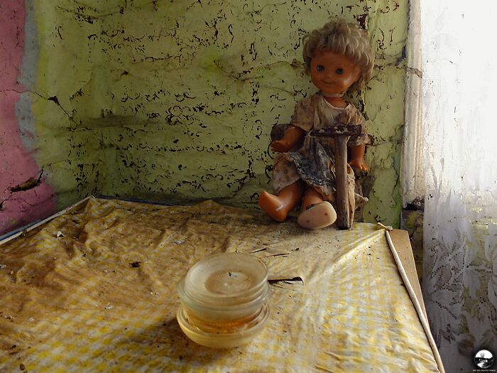 A Creepy Doll Holding The Hammer In An Abandoned House In Poland