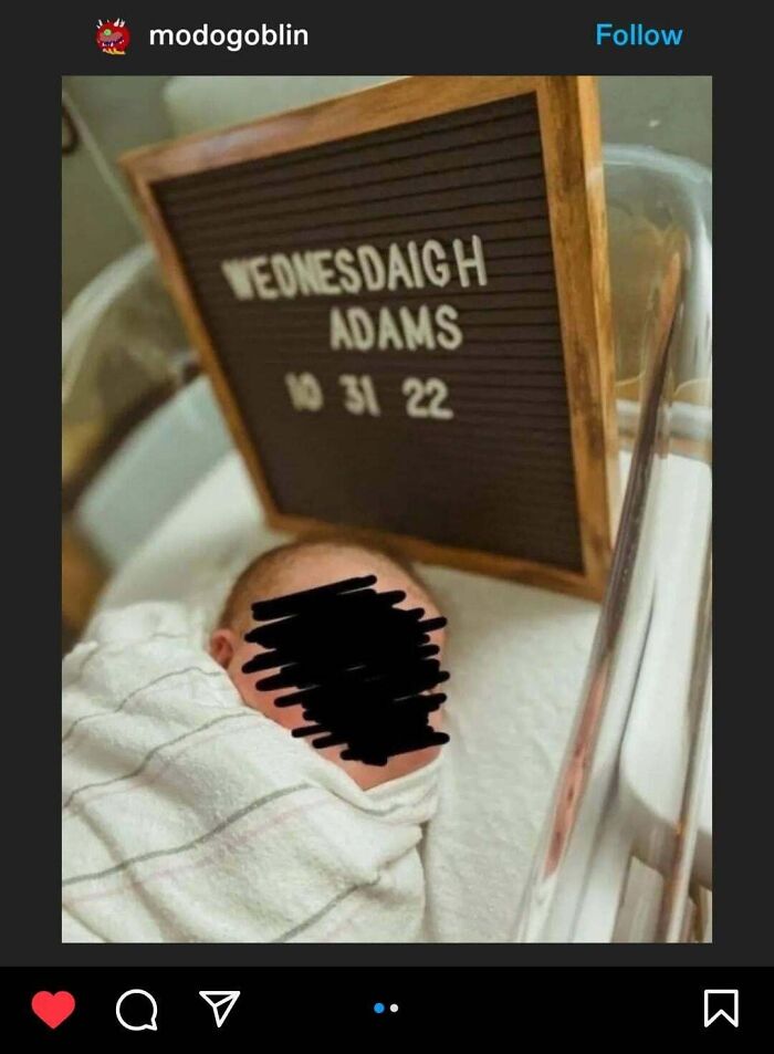 Newborn baby named Wednesdayaigh with a name board, illustrating unusual baby names.