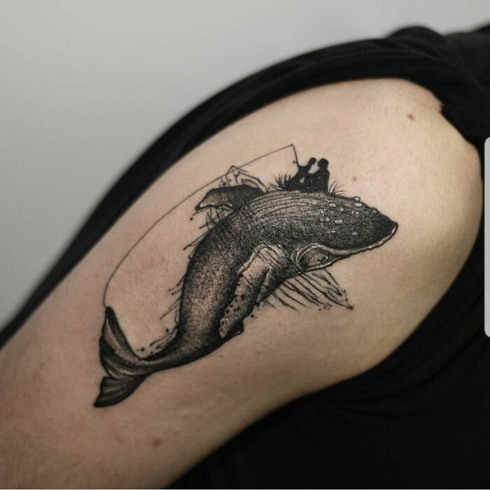 Whale memorial tattoo on arm honoring family.