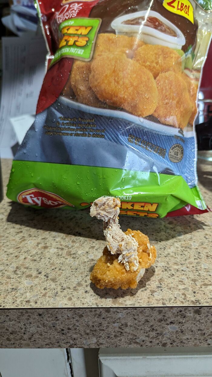 Brand New Bag Of Nuggets. Why Does It Look Like A Tiny Chicken Hatching Out?