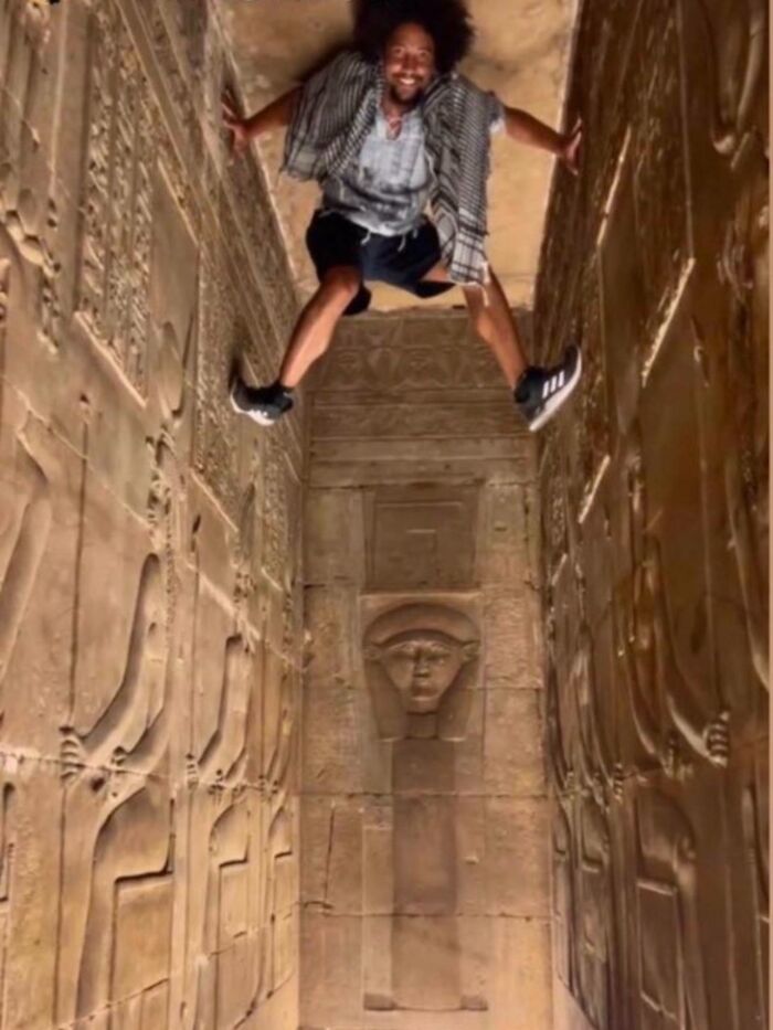 Tourist Scales Ancient Egyptian Antiquities