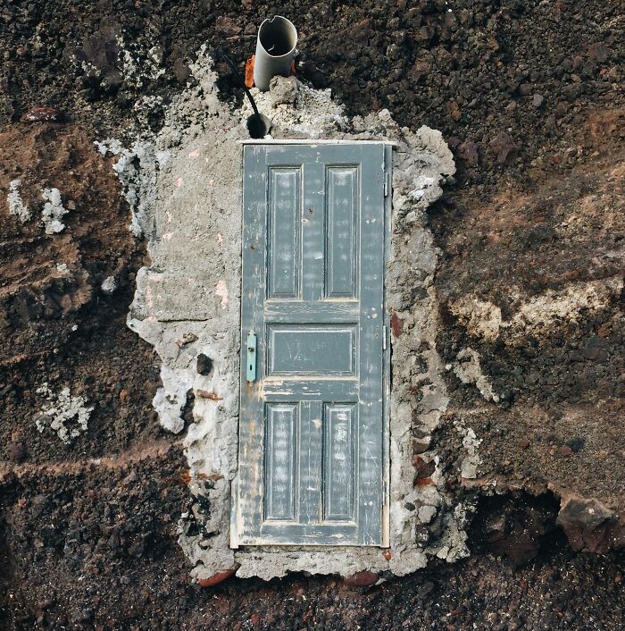 Abandoned Door In The Midst Of Boulders At Red Beach, Santorini