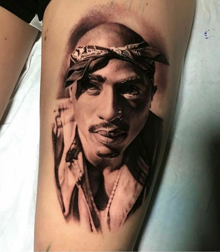 Realistic ‘90s tattoo portrait of a man with bandana, capturing cultural essence of the decade.