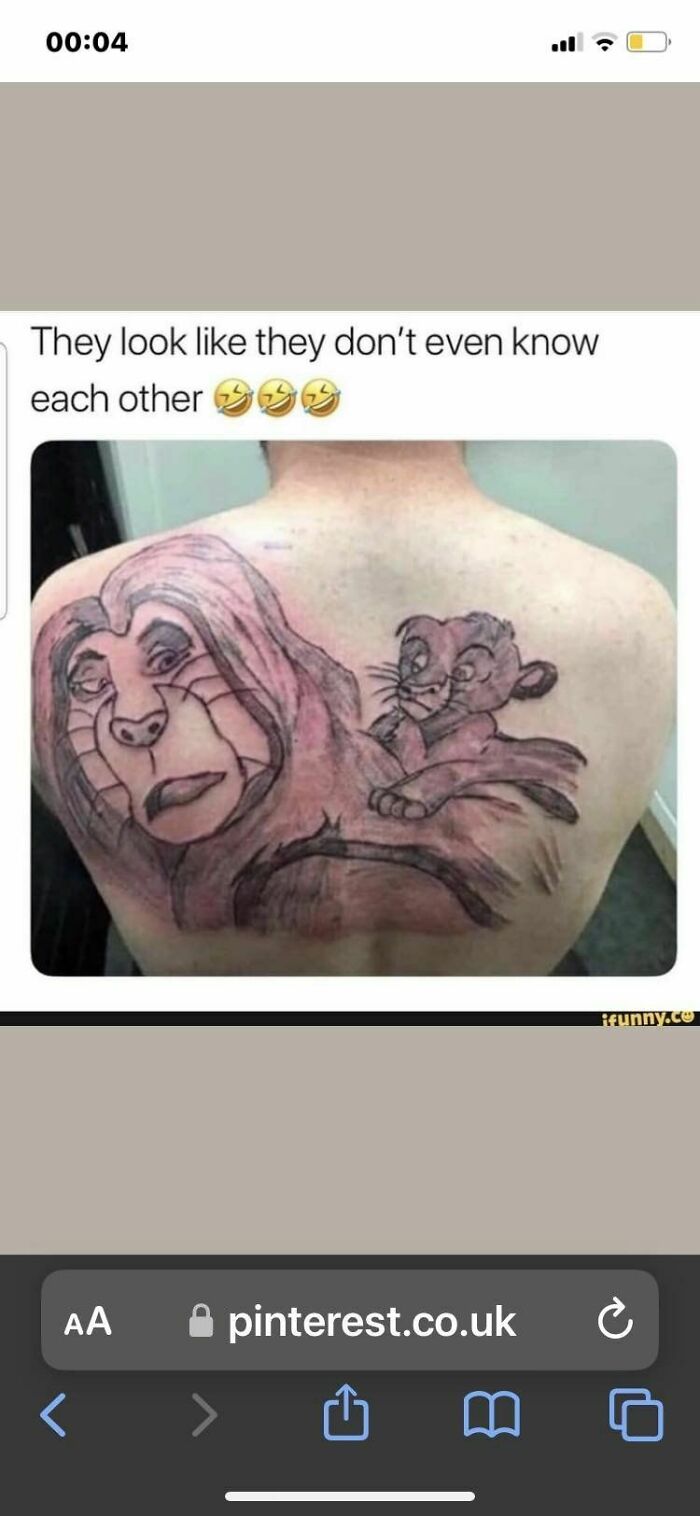 Poorly drawn lion and cub tattoo on someone's back with humorous caption.