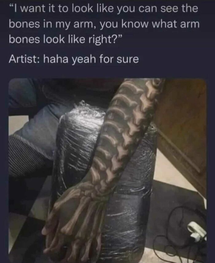 Tattoo fail showing an arm inked to look like bones, creating an unusual skeletal design.