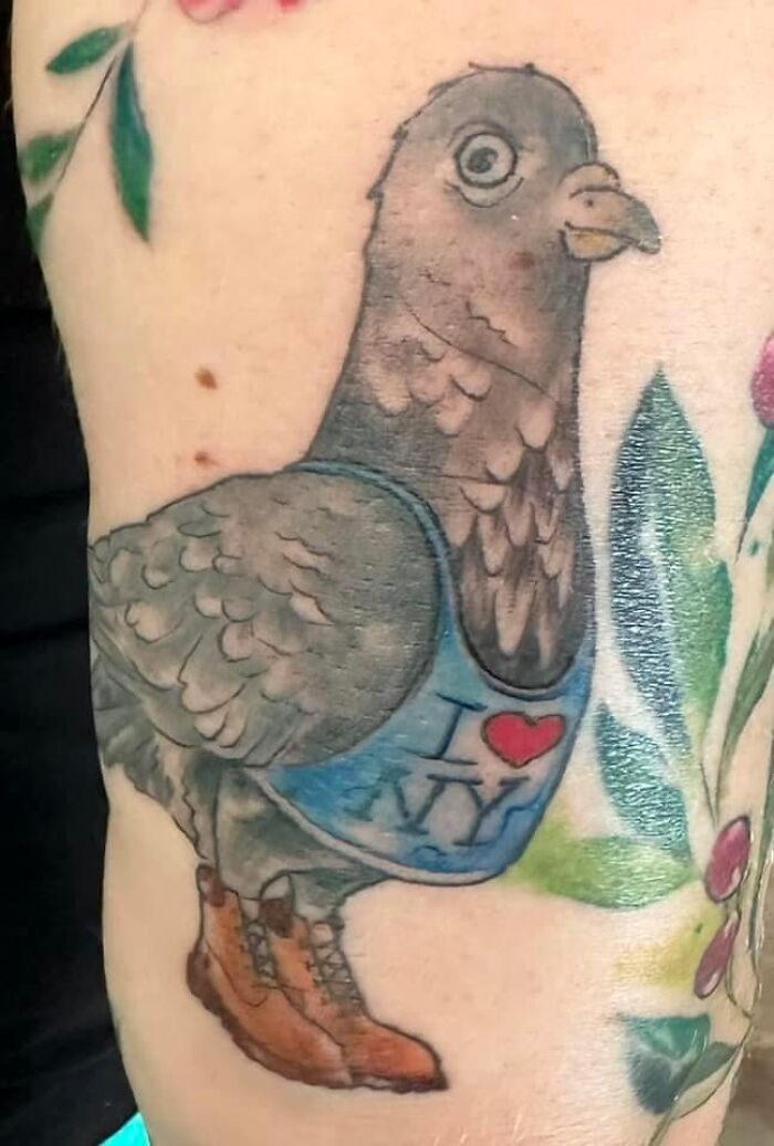 Pigeon tattoo with "I Love NY" shirt and boots, an example of worst tattoos.
