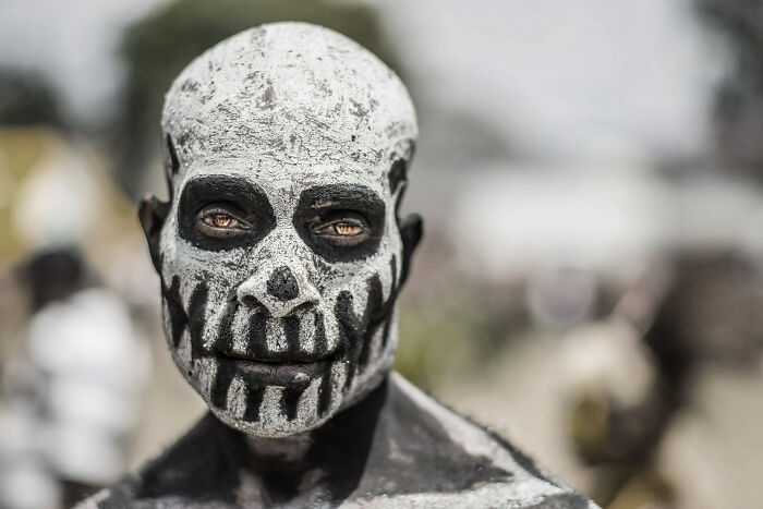 A Tribesman From Rural Papua New Guinea With His Face Painted Like An Undead Spirit 