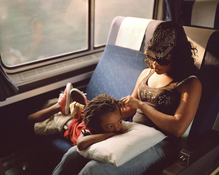 Mother Fixing Her Sons Hair On A Train 